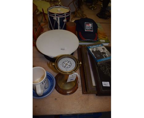 Naval ephemera, to include: a brass binacle compass; a commemorative mug for Horatio Nelson; a hat from the H.M.S. Raleigh; a