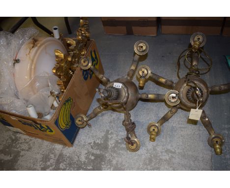 Two brass five-branch electric candleabra; three moulded gold painted wall light fittings; and an Art Deco glass ceiling ligh
