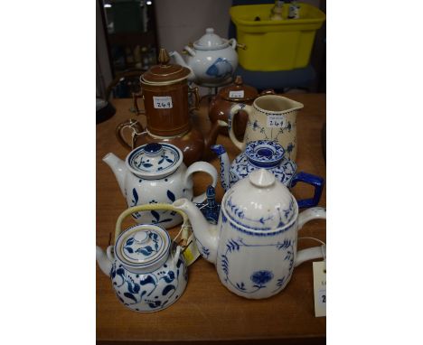 Five ceramic Asian style teapots; a Royal Worcester coffee pot and teapot; etc.