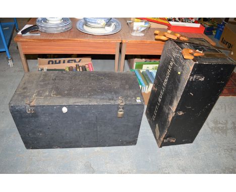 Two travelling trunks belonging to Lt. J. Taugh, R.N.V.R.; together with a small quantity of garden tools and three saws.