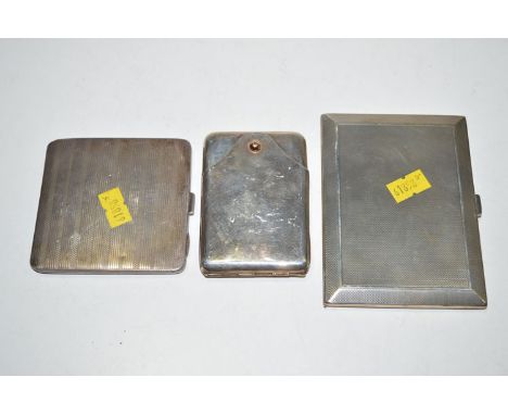 Three silver cigarette cases, two with engine turned design; one with gilt thumb push.