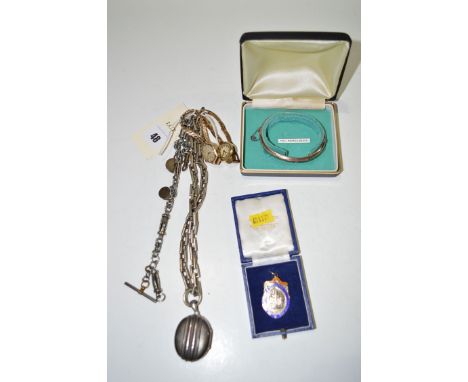 A white metal Victorian oval locket pendant on rectangular link chain; two gold cased wristwatches; a silver bangle; and a si