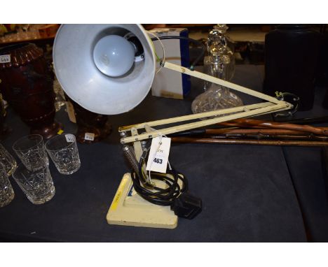 A 20th Century electric anglepoise lamp, by Herbert Terry & Sons Ltd; together with an oak framed bevelled wall mirror.  (2)