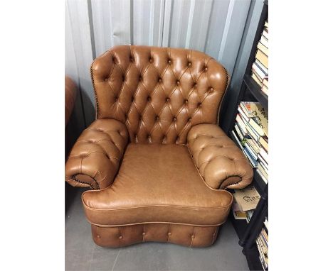 Button back brown leather chair