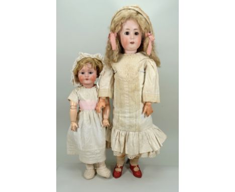 Large Goebel 120 bisque head doll, circa 1915, with brown glass eyes, finely painted lashes and brows, open mouth with upper 