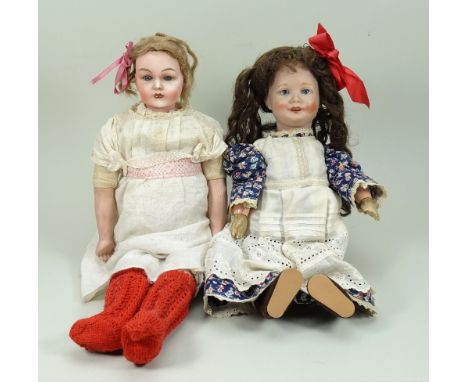 Two English bisque head dolls, 1915-20, including a Goss shoulder head doll with fixed blue glass eyes, closed mouth and ligh