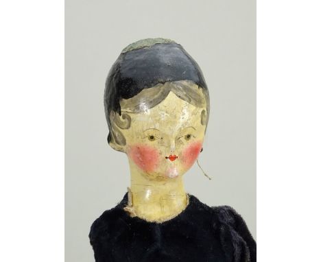 A good early painted wooden Grodnertal doll, German circa 1820, the well carved painted gesso head with finely painted featur