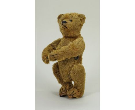 A rare Bing clockwork Roller Skater Teddy Bear, German circa 1912, the brown mohair bear with black boot button eyes, stitche