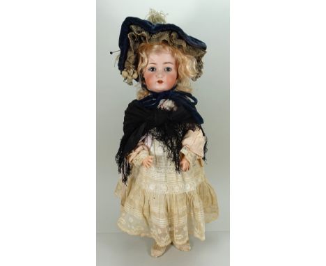 Goebel bisque head doll, German circa 1910, with weighted blue glass eyes, raised eyebrows, open mouth with upper teeth and b