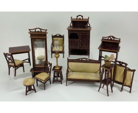 A suite of twelve Art Noveau wooden Dolls House furniture, circa 1890, the maroon and gold painted suite comprising, side cab