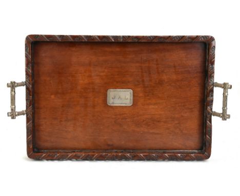 A Chinese rosewood tray with pierced gallery and white metal bamboo-effect handles, with central plaque inscribed 'JAL', leng