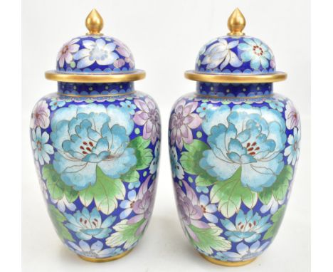 A pair of Chinese cloisonné enamel vases painted with butterflies and floral sprays, on cobalt blue ground, height 24.5cm (2)