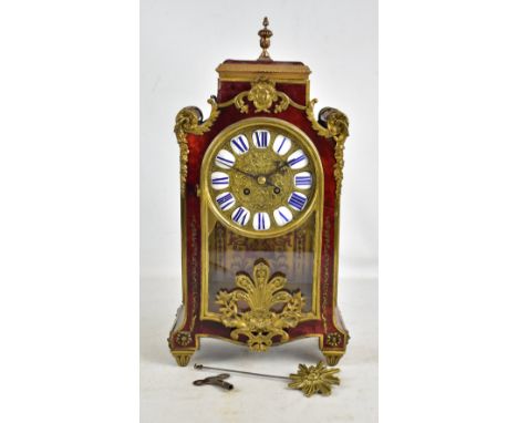 An early to mid 20th Century French boulle work mantel clock, the circular dial set with applied individually enamelled Roman