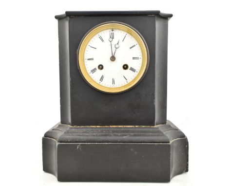 LEE &amp; SON OF PARIS; a Victorian slate mantel clock, the circular enameled dial with Roman numerals, height 28cm.Additiona