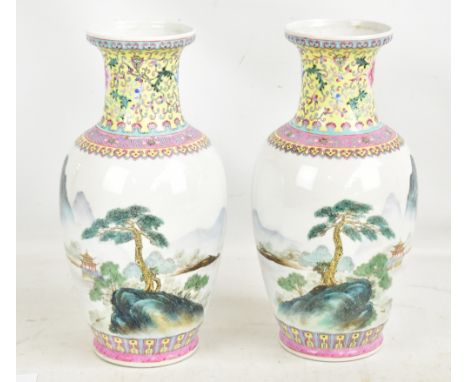 A pair of 20th century Chinese porcelain baluster vases decorated in enamels with floral scrolls and ruyi border to upper sec