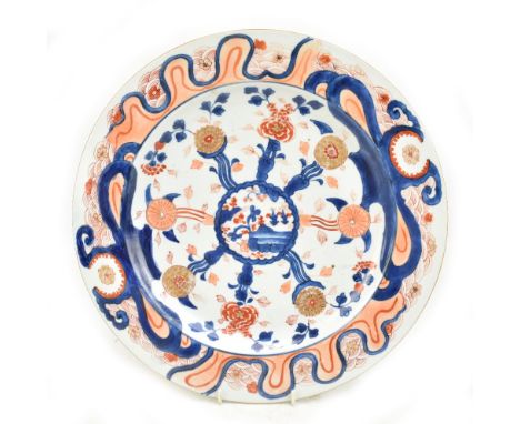 A Chinese porcelain Imari decorated charger, painted with central landscape scene inside floral and scrolling setting, bears 