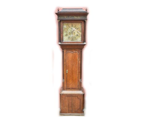 A George III oak cased eight day longcase clock, the brass face set with circular dial with Roman and Arabic numerals and sub