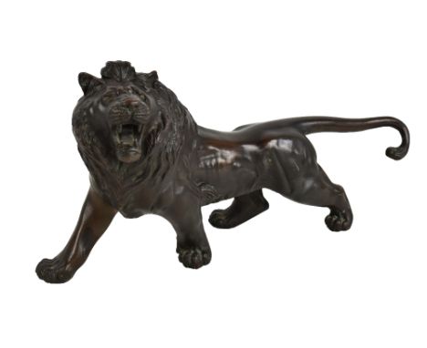 A large&nbsp;20th century&nbsp;Japanese bronze figure of a lion standing for square, unmarked, length 44cm.Additional Informa