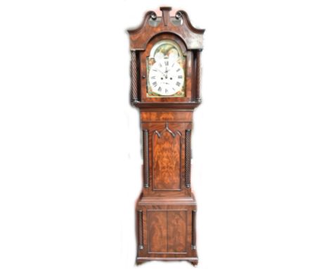 DUMVILE OF STOCKPORT; an early 19th century mahogany eight day longcase clock with twisted column supports and arched door on