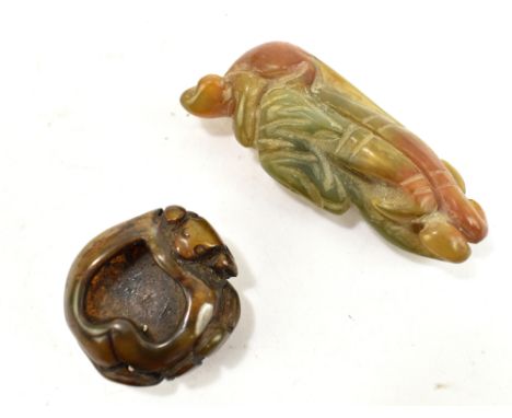 A Chinese jade carving depicting a monkey perched upon a Buddha's hand (or fingered citron) fruit, length 7cm, and a miniatur