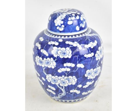 A late 19th/early 20th century Chinese porcelain lidded ginger jar painted in underglaze blue with blossoming prunus, apocryp