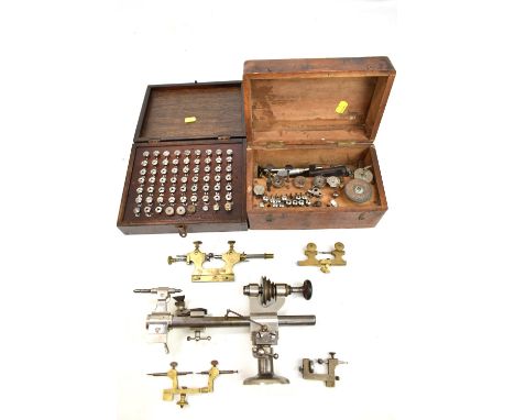 A group of clock manufacturer and repair tools and accessories including G.Boley lathe, clamps, screws including number set i
