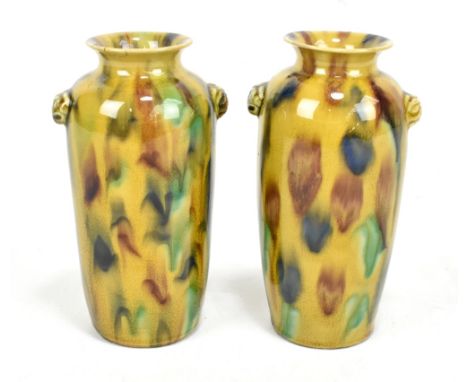 A pair of 19th century Chinese mottled tortoise shell glazed vases with applied masks beneath the everted rims, unmarked, hei