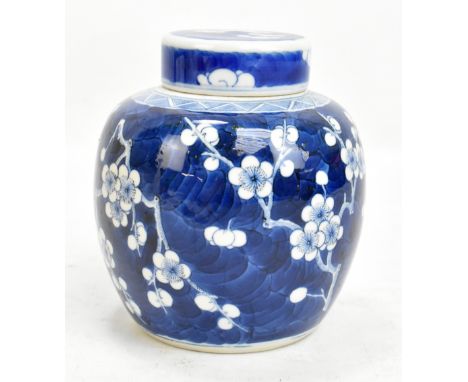 A late 19th/early 20th century Chinese porcelain ginger jar and cover decorated with prunus, bearing apocyrphal six character