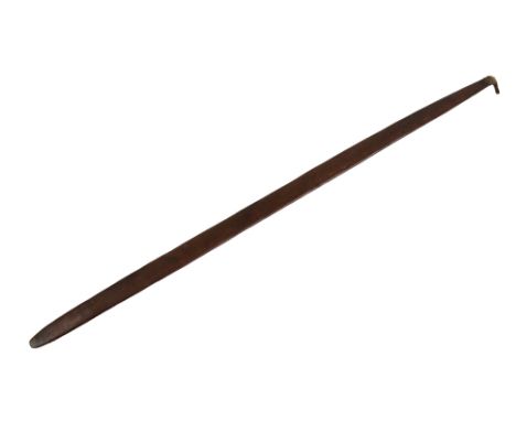 A late 19th century Australian Aboriginal woomera of flattened oval form with hand tied notch to one end, length 96cm.Additio
