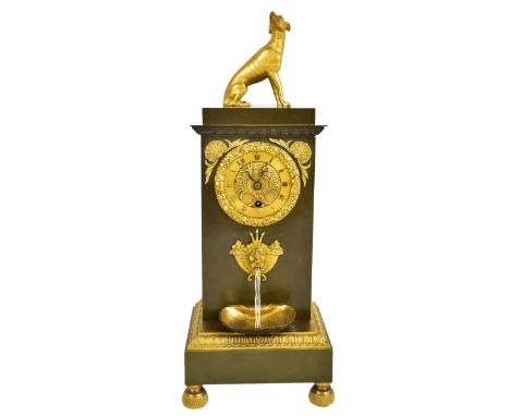 DELAUNOY OF PARIS; a 19th century bronze and ormolu water clock with greyhound finial above circular dial set with Roman nume