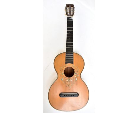 An early 20th century six string acoustic guitar with inlaid, painted and mother of pearl decoration and birdseye maple back.