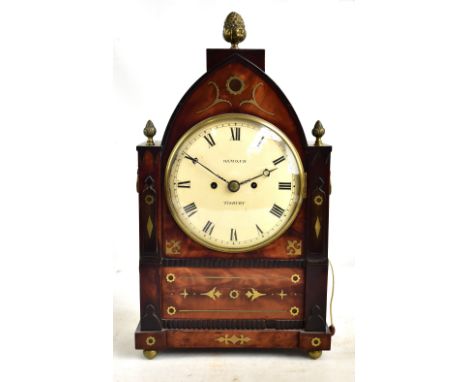 OSMOND OF TISBURY; a Regency mahogany brass inlaid lancet top mantel clock, the circular dial with Roman numerals, inside inl