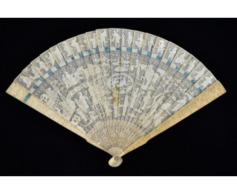 A late 19th century Chinese Export carved ivory brisé fan, the outer sticks featuring dragons amongst clouds chasing Sacred P