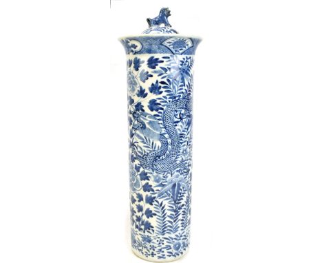 A Chinese blue and white porcelain sleeve vase and cover painted with a four claw dragon amongst floral sprays, bears Kangxi 