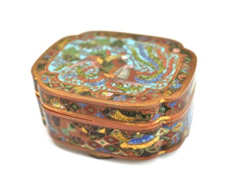 A Japanese cloisonné lidded trinket box of shaped outline, decorated with a mythical bird inside floral setting, with five ci