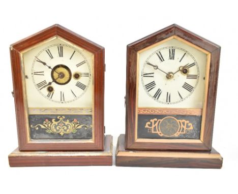 Two late 19th century German mantel clocks of arched form, both with circular dials set with Roman numerals behind glazed doo