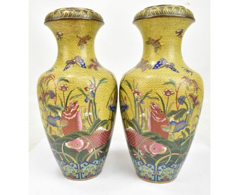 A good mirror pair of mid-late 19th century Chinese&nbsp;cloisonné enamel baluster vases with garlic necks, decorated with ca