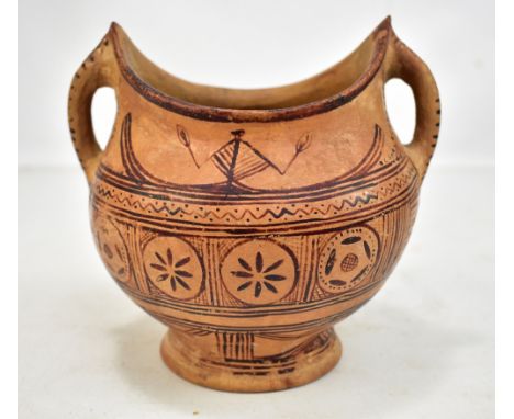 A circa 200BC Cypriot painted terracotta twin handled vessel on spreading circular foot, height 18cm.Additional InformationRu