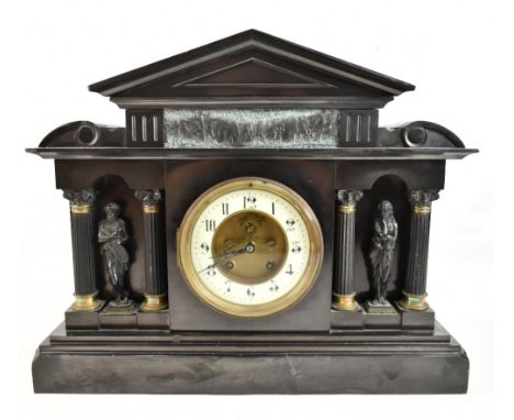 A D MOUGIN; a late 19th century French black slate mantel clock of architectural form featuring Classical-style frieze above 