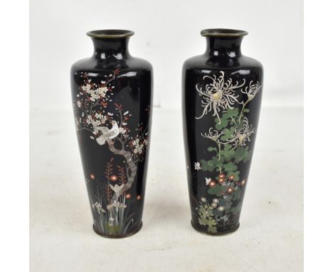 A pair of early 20th century Japanese cloisonné enamelled vases of tapered form, the first featuring single bird perched on b