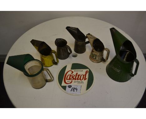 Selection of Shell, Castrol and BP oil jugs and cast iron Castrol sign