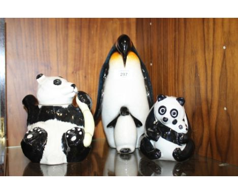 A WADE WWF PANDA MONEY BOX TOGETHER WITH A BESWICK PANDA TEAPOT AND AN AYNSLEY RESIN PENGUIN AND CHICK FIGURE (3)