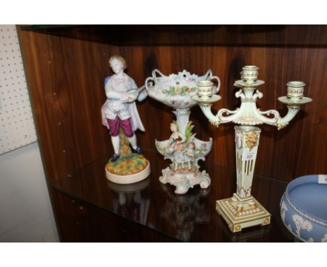 AN ANTIQUE THREE BRANCH CANDLE STICK A/F TOGETHER WITH TWO CONTINENTAL STYLE FIGURES