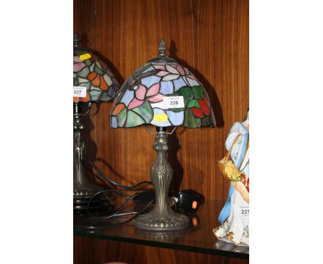 A TIFFANY STYLE LAMP AND SHADE