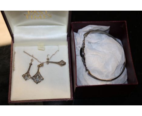 A BOXED PAST TIMES BANGLE AND PENDANT AND EARRINGS SET