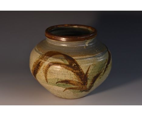 A Studio Pottery Leach type stoneware compressed ovoid vase, painted with a band of leafy fronds in shades of brown on a mott