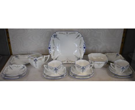 A Shelley Blue Iris pattern Queen Anne shape part tea set, comprising three teacups, five saucers, six tea plates, milk jug, 