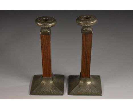 A pair of Art Deco rosewood pewter mounted table candlesticks, by Hutton of Sheffield, each rectangular column mounted with a