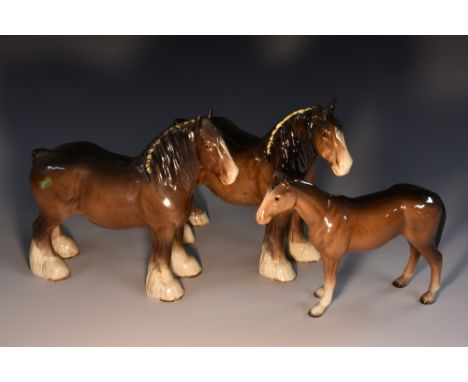 A Beswick model, of a shire horse, standing, four square, 27cm long, printed mark; another, similar; a Melba Ware horse (3)