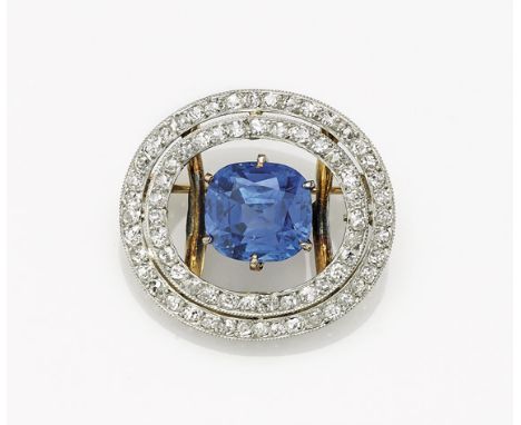 BLUE SAPPHIRE & WHITE GOLD BROOCHBright blue cushion-cut, unheated Sri Lankan sapphire, weighing approx. 4.0 Cts., prong-set 